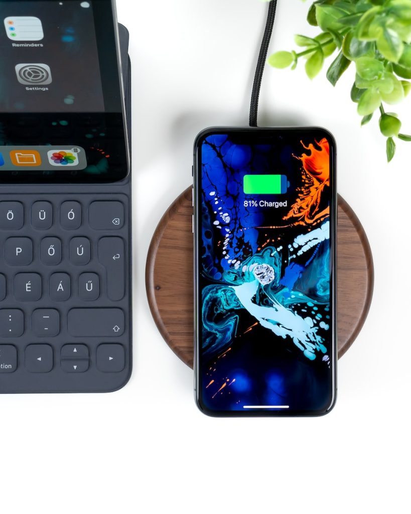smartphone on wireless charging case at 83 percent charge