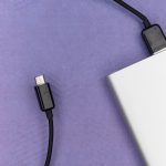black usb cable on white laptop computer