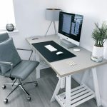 gray leather office rolling armchair beside white wooden computer desk